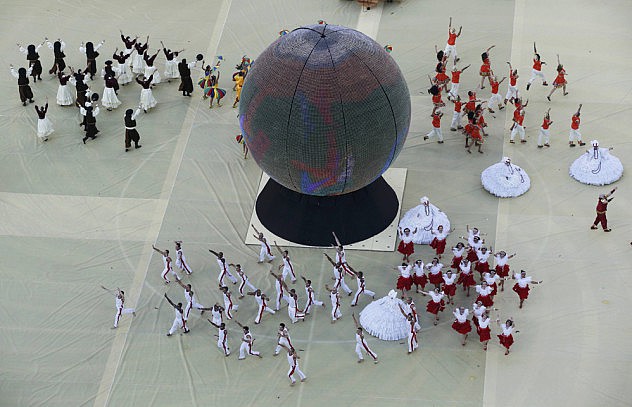Performers take part in the 2014 World Cup opening ceremony at the Corinthians arena in Sao Paulo