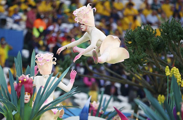Performers participate in the opening ceremony of the 2014 World Cup at the Corinthians arena in Sao Paulo