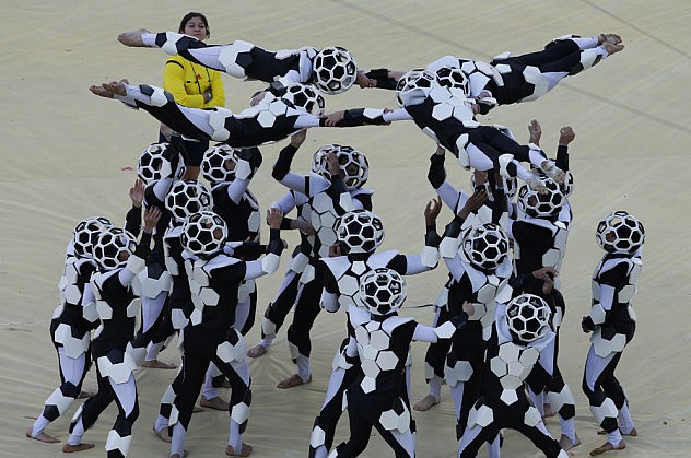 Performers take part in the 2014 World Cup opening ceremony in Sao Paulo