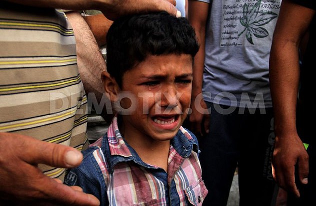 1405532046-palestine-mourns-death-of-4-children-killed-in-israeli-attack-on-beach_5279453