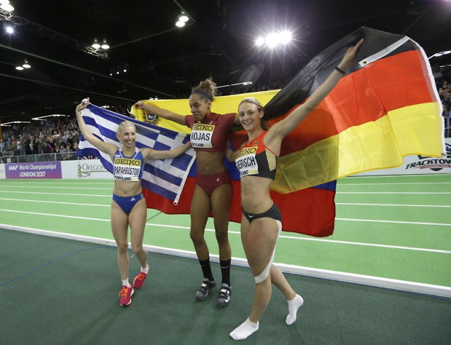 Venezuela's Yulimar Rojas, center, celebrates with Germany's Kristin Gierisch, right, and Greece's Paraskevi Papahristou, left, after Rojas won the women's triple jump final during the World Indoor Athletics Championships, Saturday, March 19, 2016, in Portland, Ore. Gierisch finished second, and Papahristou finished third in the event. (AP Photo/Elaine Thompson)